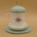 This shows the backside of the cup with the handle on the left. This shows the backside of the cup with the handle on the left.